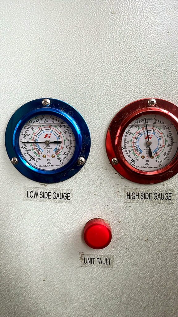 Low and high side pressure gauges on a refrigeration unit