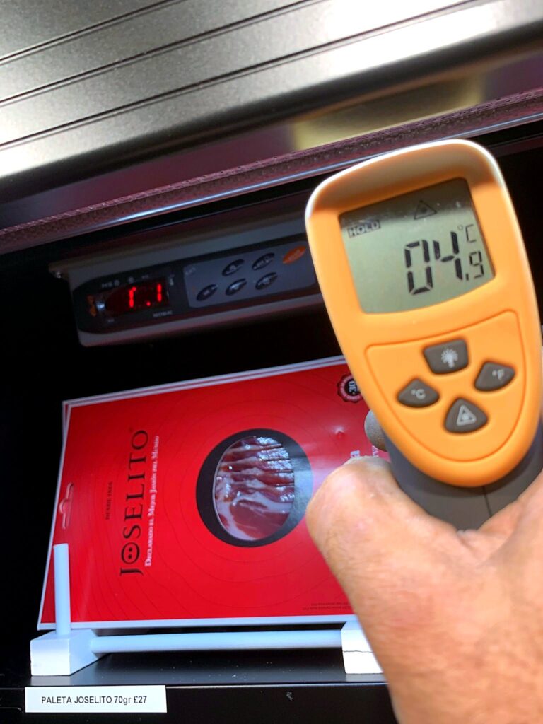 Infrared temperature check on a refrigerated display