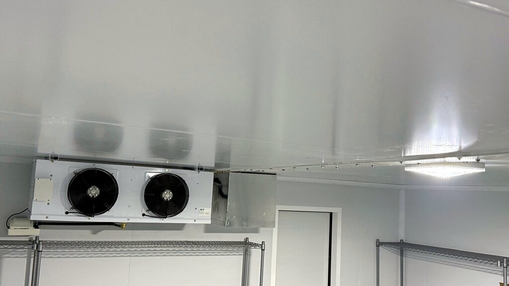 Twin-fan evaporator installed in a finished cold room