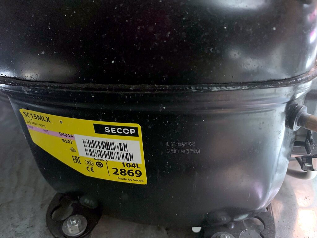 Hermetic compressor inspected during maintenance