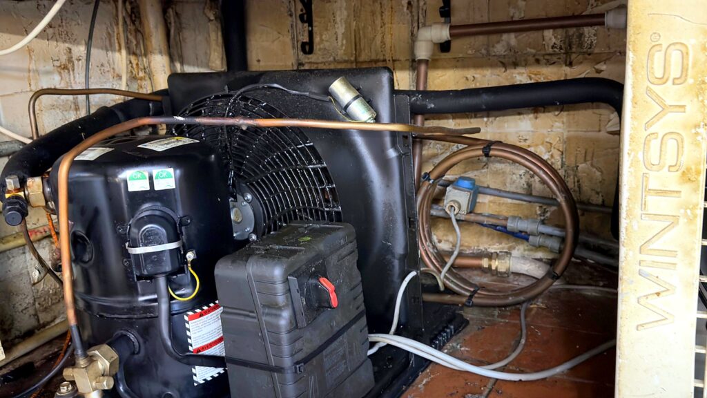 Refrigeration compressor and condenser in a plant area
