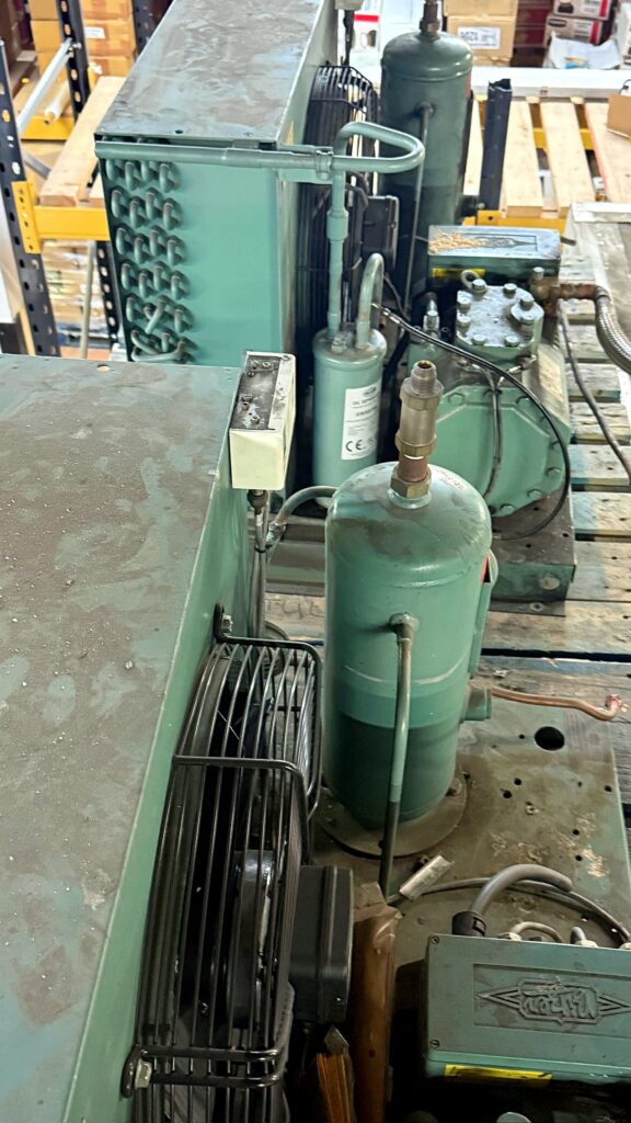 Refrigeration compressors and receiver in a plant room