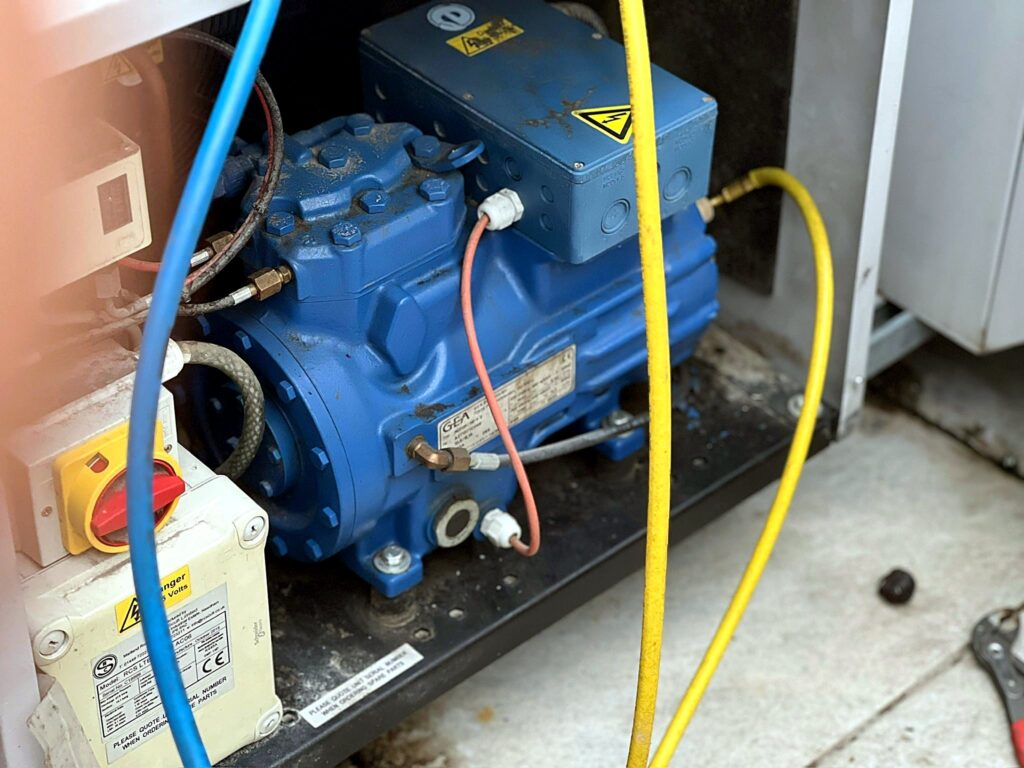 Semi-hermetic compressor during service with gauges connected