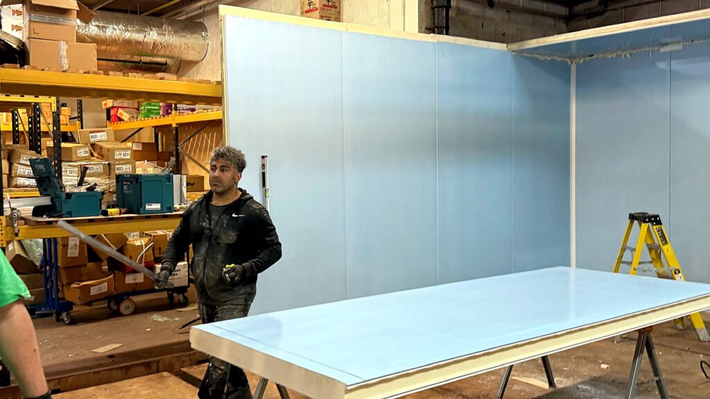 Cold room panels and floor sections being prepared